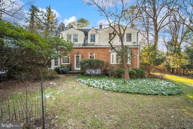 view of front of home with a front yard