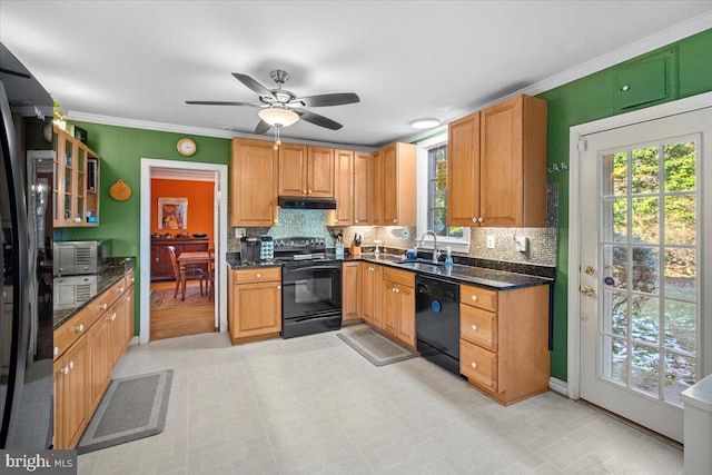 kitchen with ornamental molding, sink, decorative backsplash, and black appliances