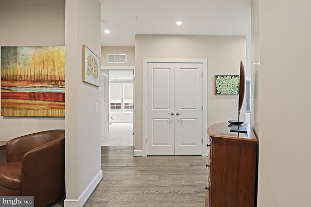 hallway featuring light wood-type flooring