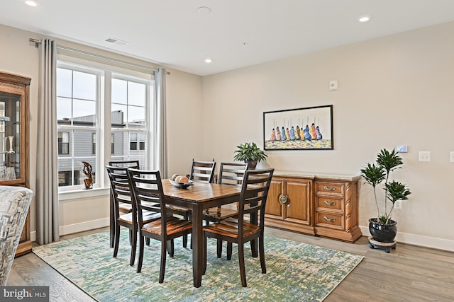 dining space with light hardwood / wood-style flooring