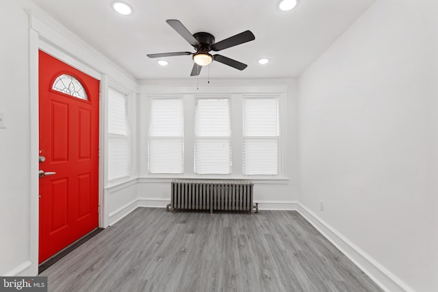 entrance foyer featuring ceiling fan, recessed lighting, baseboards, light wood-type flooring, and radiator