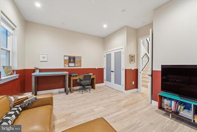 office featuring french doors and light hardwood / wood-style flooring