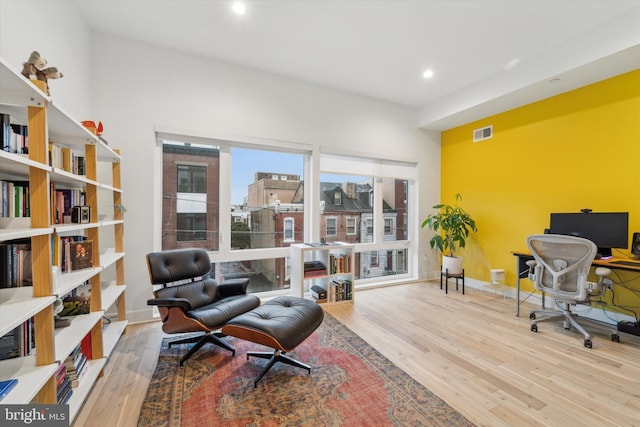 office area with light hardwood / wood-style floors