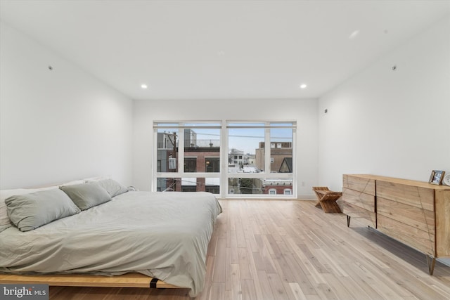 bedroom with light hardwood / wood-style floors