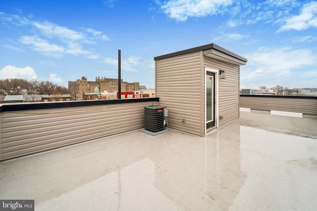 view of patio / terrace featuring a balcony and central air condition unit