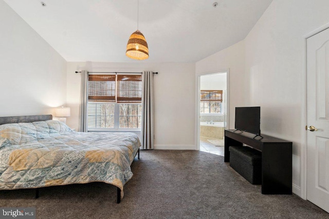 carpeted bedroom with lofted ceiling and connected bathroom