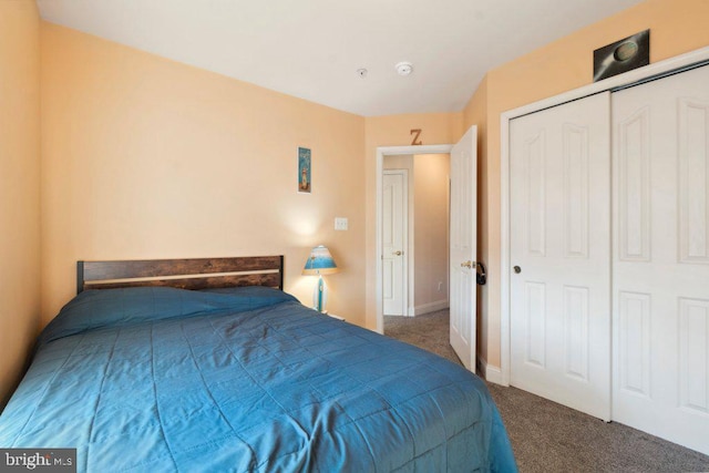 carpeted bedroom featuring a closet