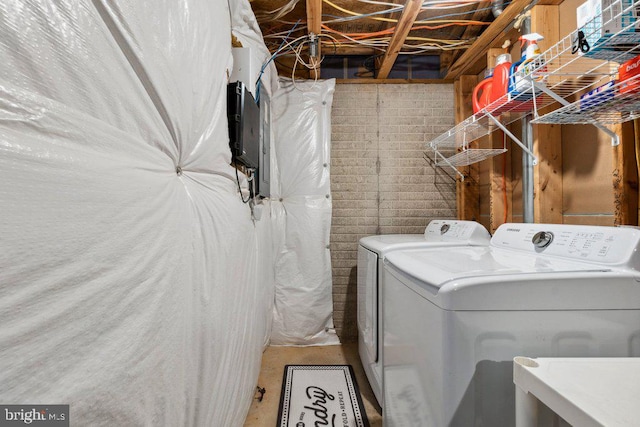 washroom featuring washer and clothes dryer