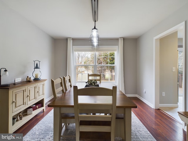 dining space featuring dark hardwood / wood-style flooring