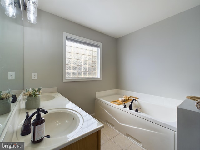 bathroom with tile patterned flooring, vanity, and a bathtub