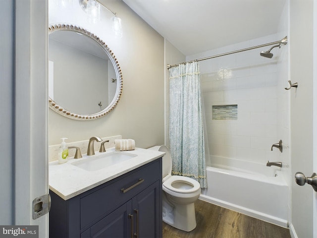 full bathroom featuring shower / tub combo, hardwood / wood-style floors, vanity, and toilet