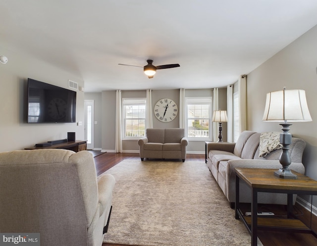 living room with hardwood / wood-style flooring and ceiling fan