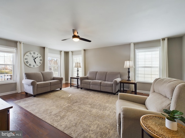 living room featuring hardwood / wood-style flooring and ceiling fan