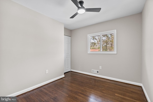 unfurnished bedroom with dark hardwood / wood-style floors and ceiling fan