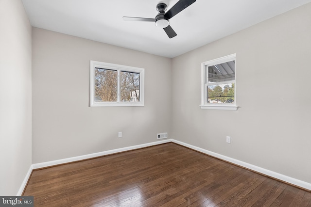 unfurnished room with hardwood / wood-style floors and ceiling fan