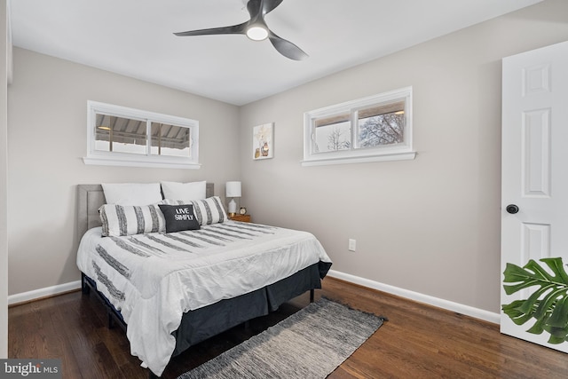 bedroom with dark wood-type flooring and ceiling fan