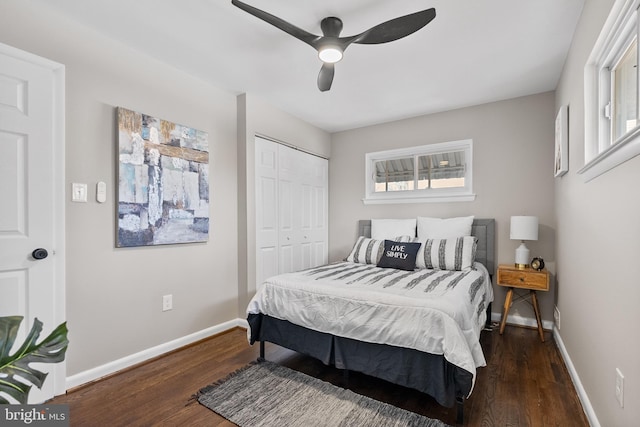 bedroom with ceiling fan, dark hardwood / wood-style floors, and a closet