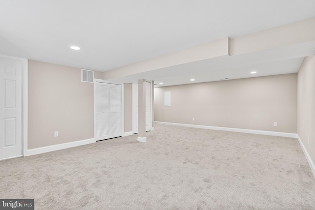 basement with light colored carpet