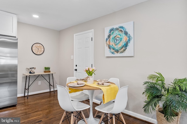 dining room featuring dark hardwood / wood-style flooring