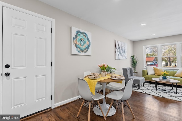 dining space featuring dark hardwood / wood-style floors