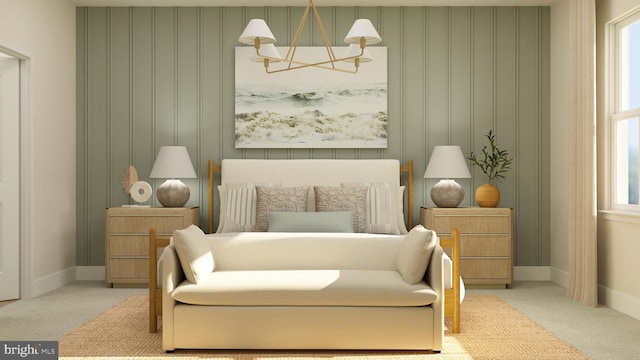 sitting room with an inviting chandelier and light colored carpet