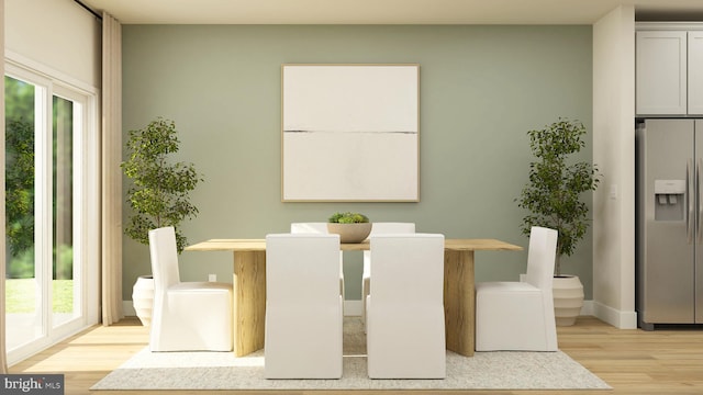 dining space featuring light hardwood / wood-style floors