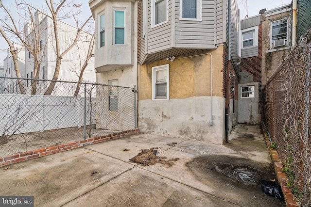 rear view of house with cooling unit