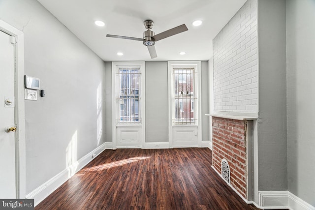 interior space featuring dark wood-type flooring and ceiling fan