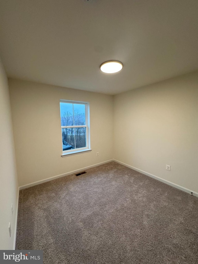 view of carpeted spare room