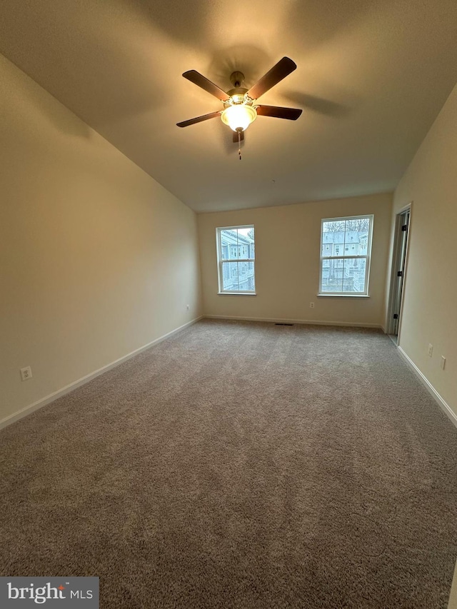 unfurnished room featuring carpet floors and ceiling fan