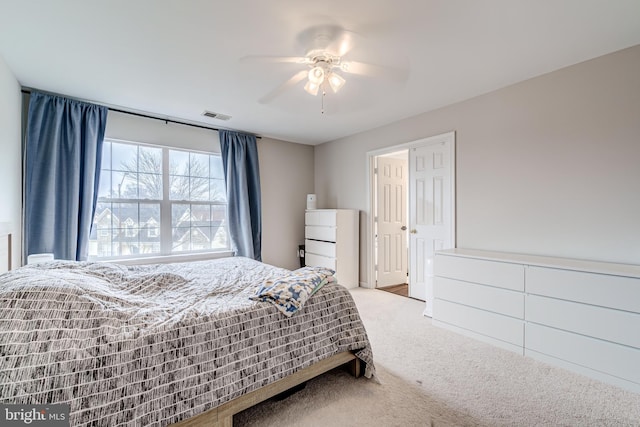 bedroom featuring ceiling fan and carpet floors