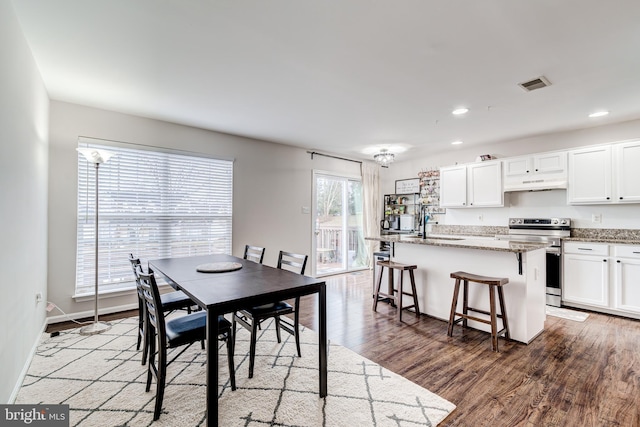 dining room featuring hardwood / wood-style flooring