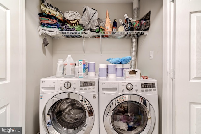 laundry room with washing machine and dryer