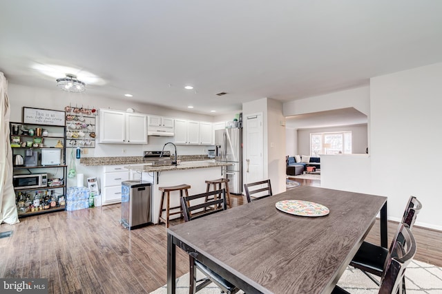 dining room with light hardwood / wood-style floors