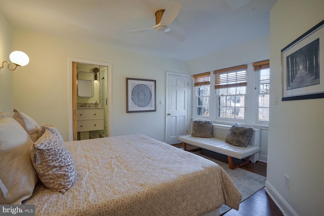 bedroom with sink, dark wood-type flooring, ceiling fan, and ensuite bathroom