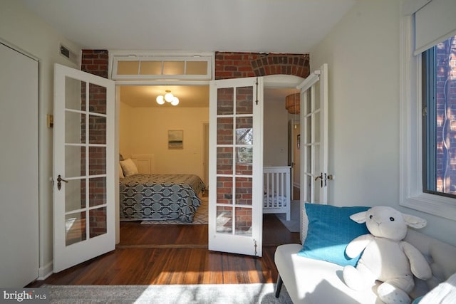 interior space featuring french doors and dark hardwood / wood-style floors