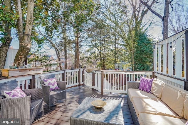 wooden deck with outdoor lounge area