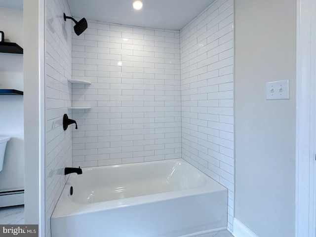 bathroom with baseboard heating and tiled shower / bath combo