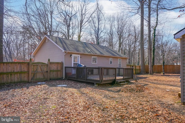 rear view of property with a wooden deck