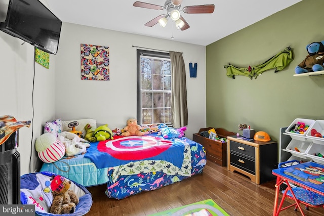 bedroom featuring hardwood / wood-style flooring and ceiling fan