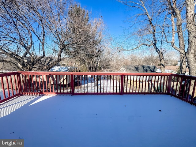 view of snow covered deck