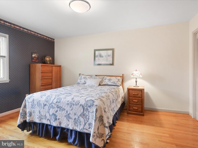 bedroom with light hardwood / wood-style floors