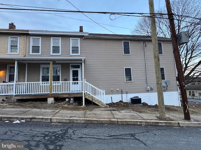 view of front of property featuring central AC and covered porch