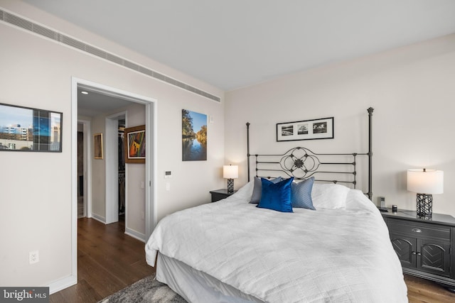 bedroom featuring dark wood-type flooring