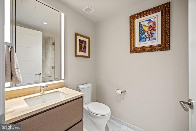 bathroom with walk in shower, vanity, and toilet