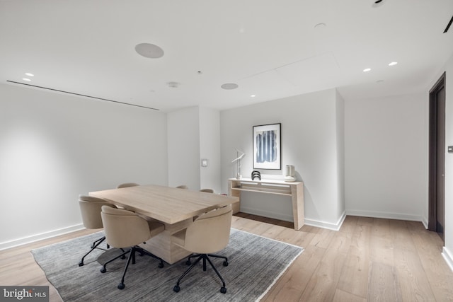 dining space featuring light wood-type flooring