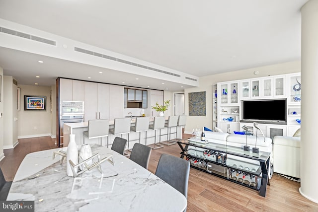 dining area with light wood-type flooring