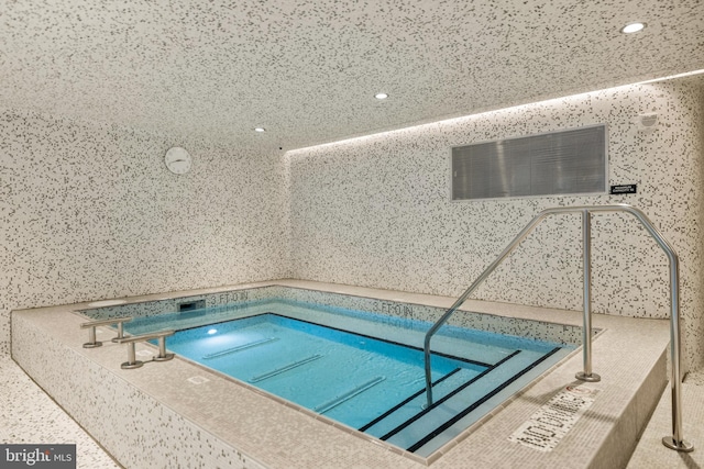 view of pool featuring an indoor in ground hot tub