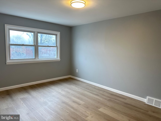 spare room featuring light hardwood / wood-style flooring