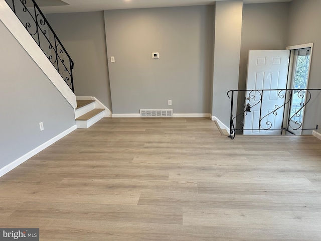 entrance foyer with light hardwood / wood-style flooring